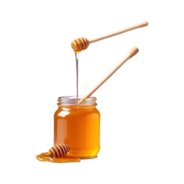 Glass jar of honey with wooden dippers on white background