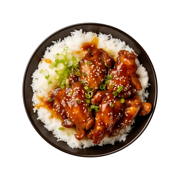 Chicken teriyaki over steamed rice in a bowl