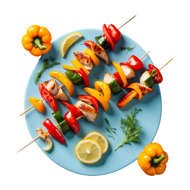 Grilled chicken and vegetable skewers on a blue plate
